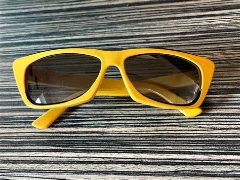 yellow Gucci sunglasses